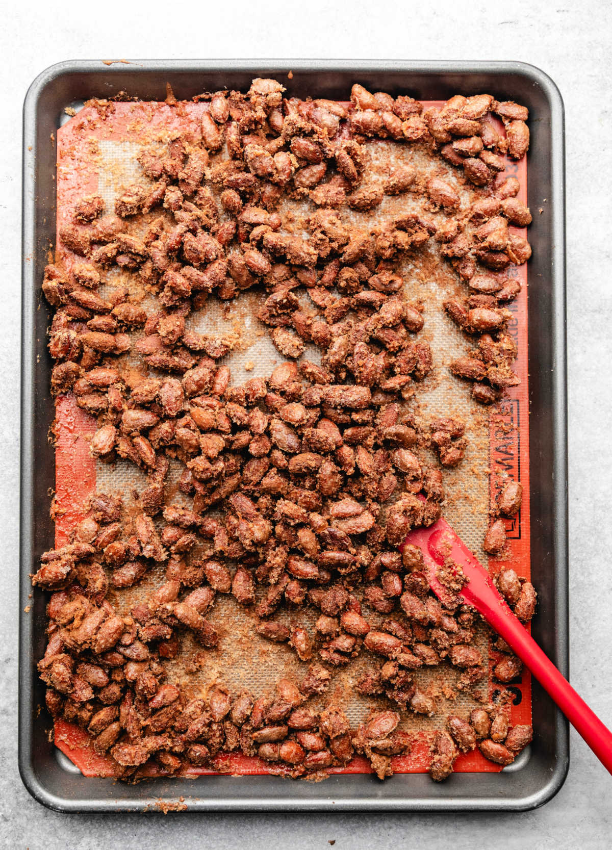 Baked candied almonds on a baking sheet. 