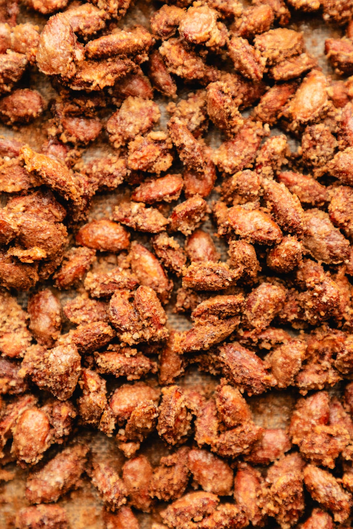 Baked candied almonds on a baking sheet. 