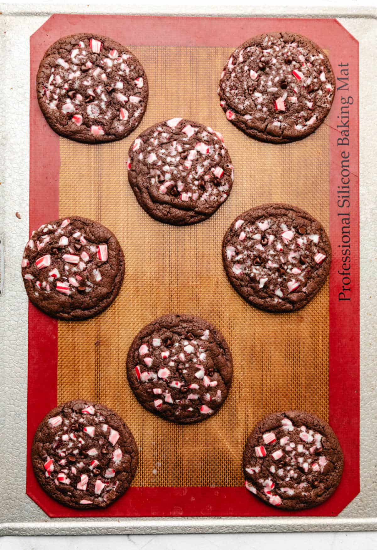 Baked chocolate peppermint cookies on a baking sheet. 