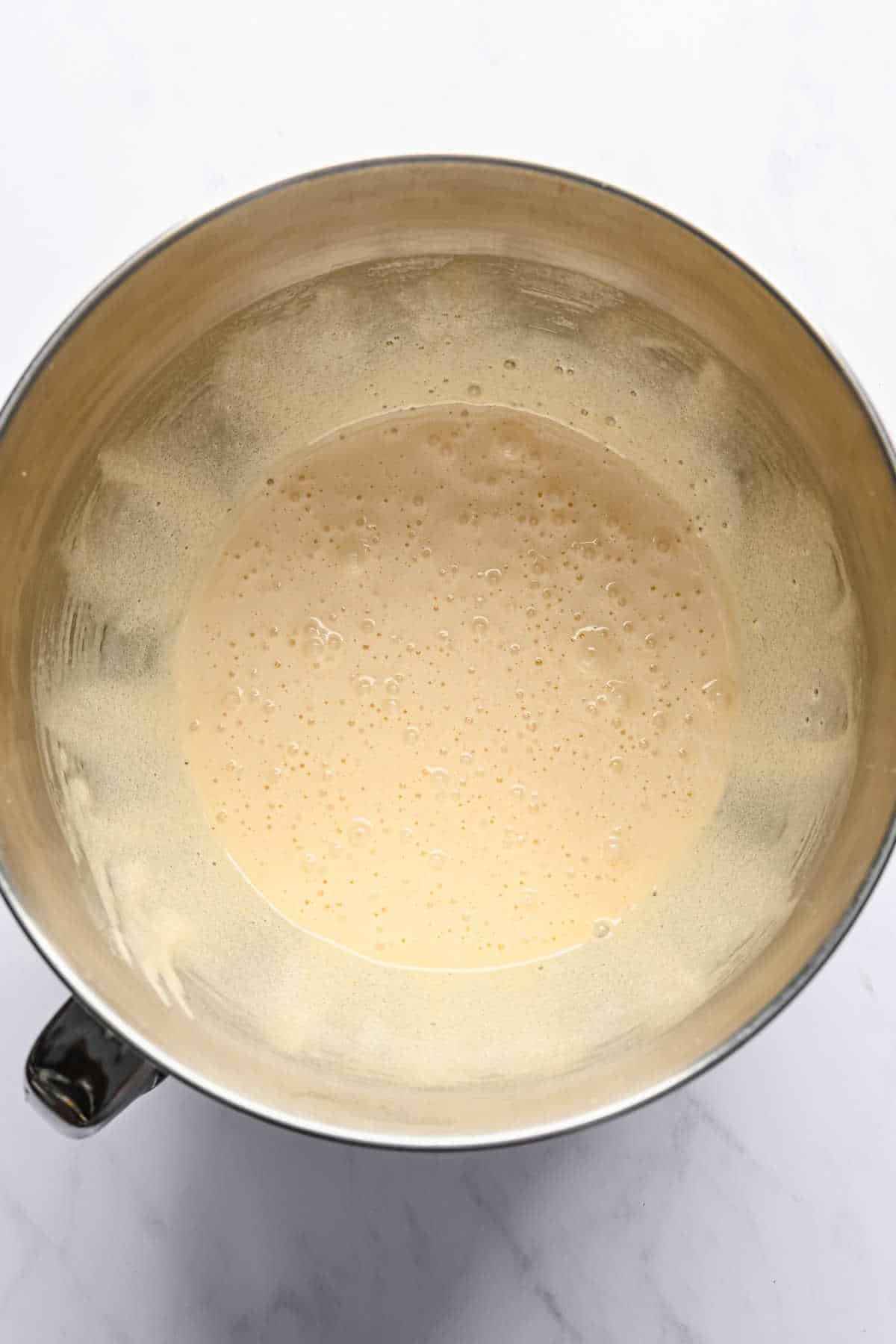 Beaten egg and sugar mixture in a mixing bowl. 