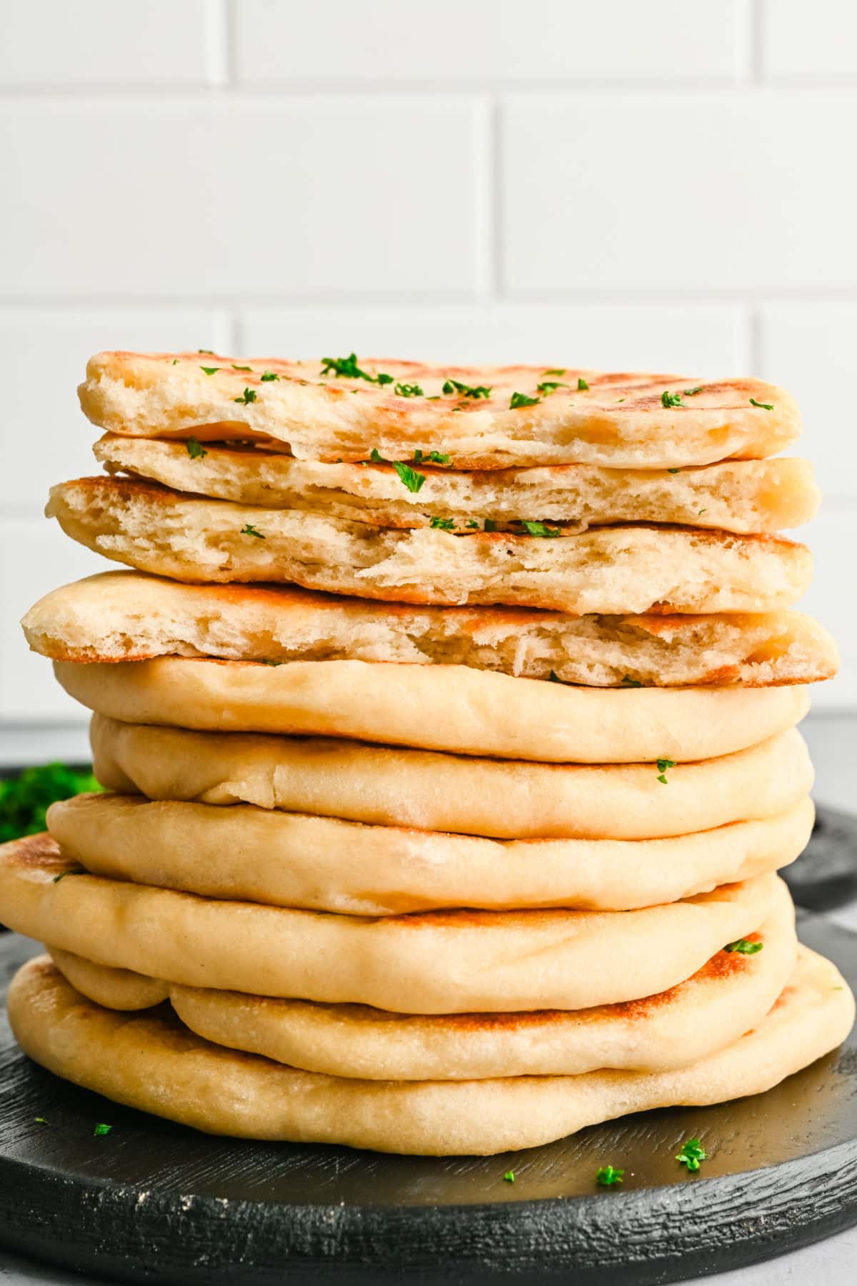 A stack of easy flatbreads with the top two in half. 