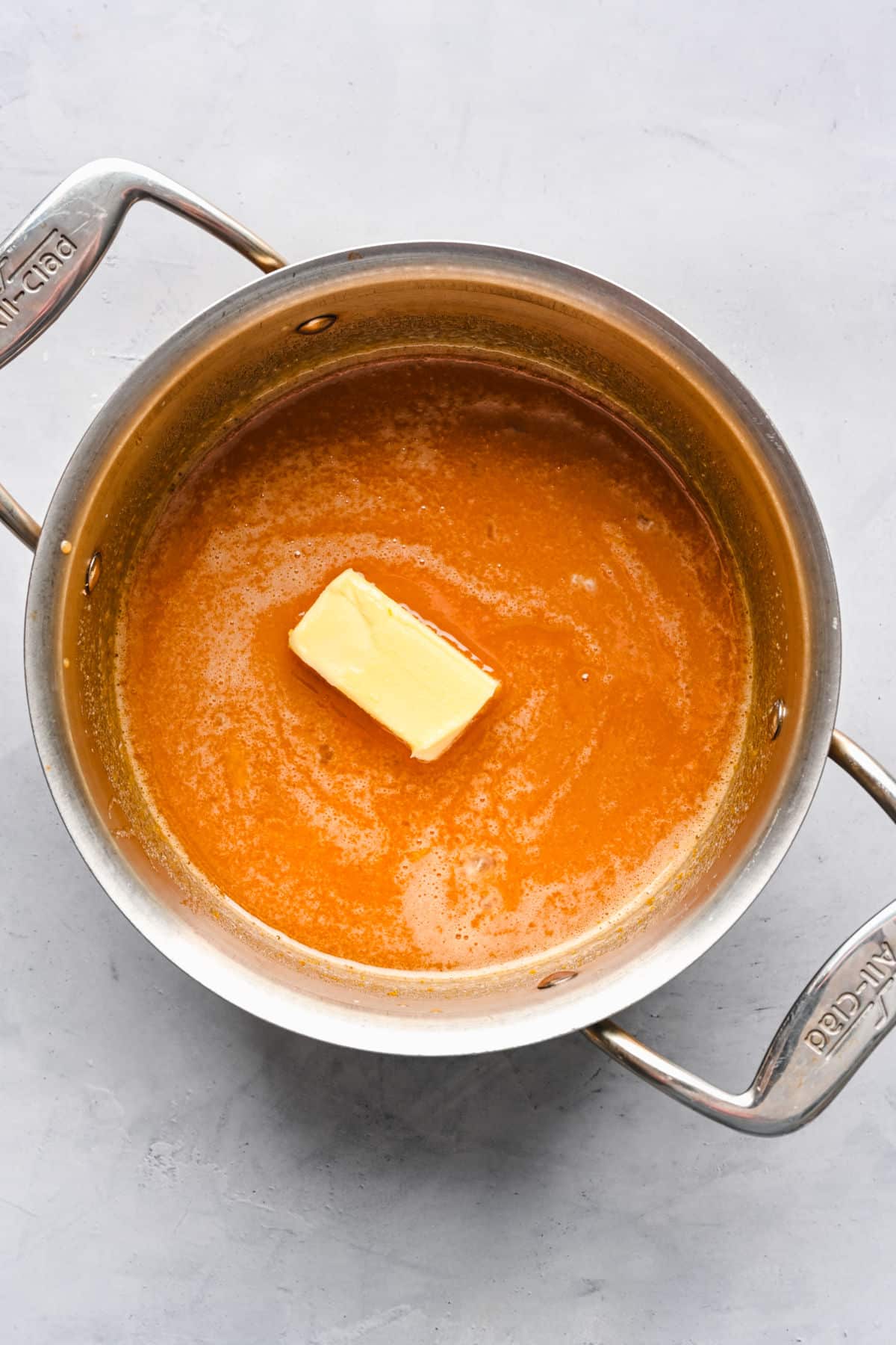 Butter melting in a brown sugar egg yolk mixture. 