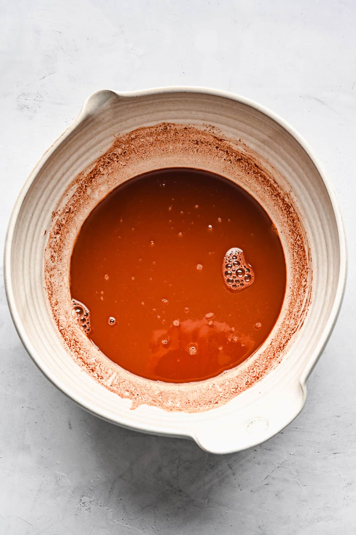 Melted chocolate in a mixing bowl. 