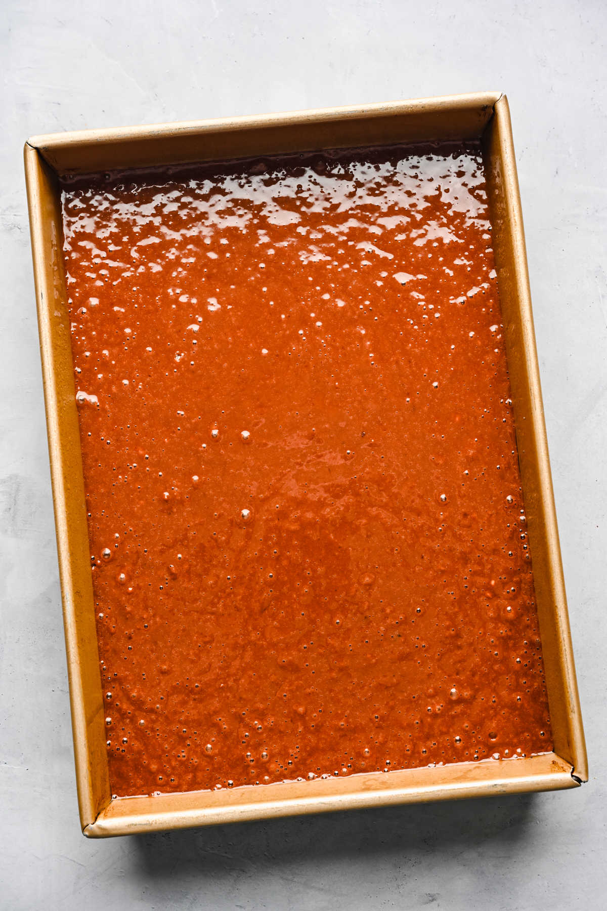 German chocolate sheet cake batter in a baking pan.