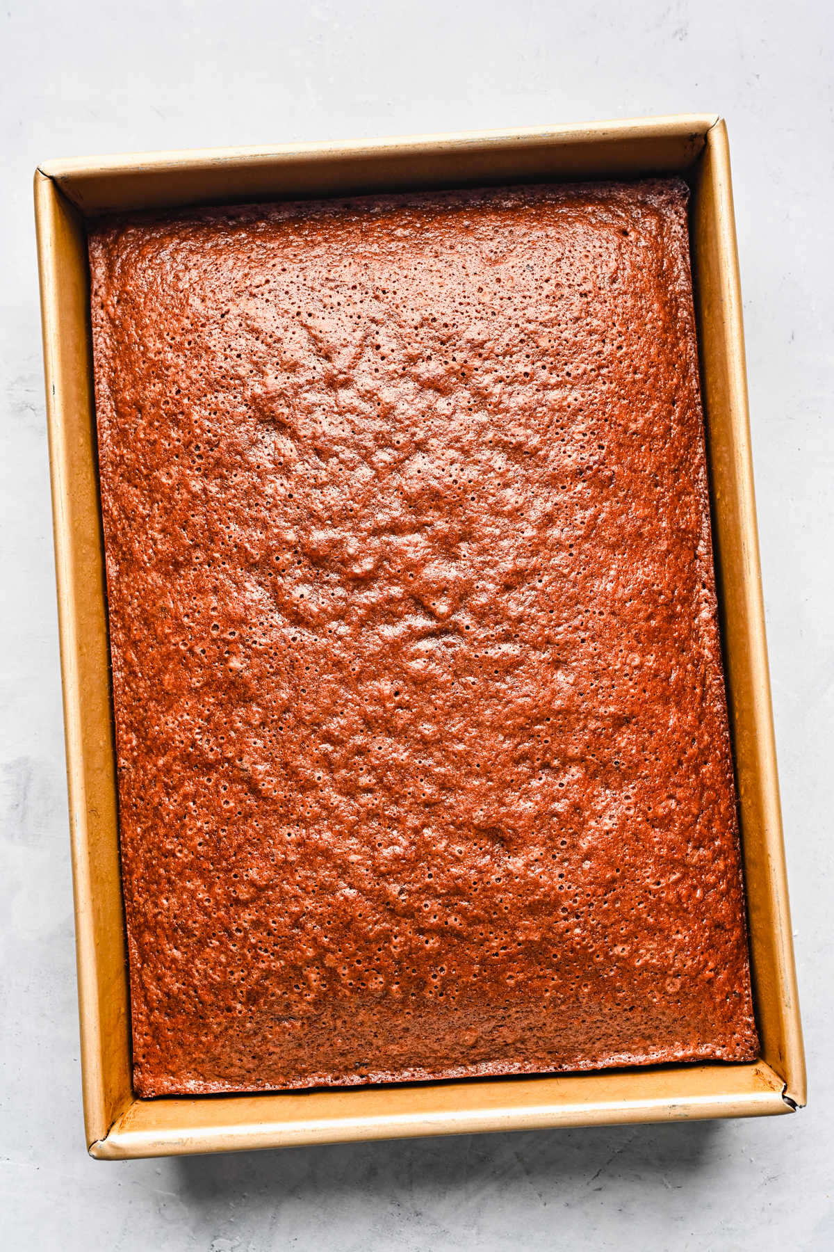 Baked German chocolate cake in a sheet pan.