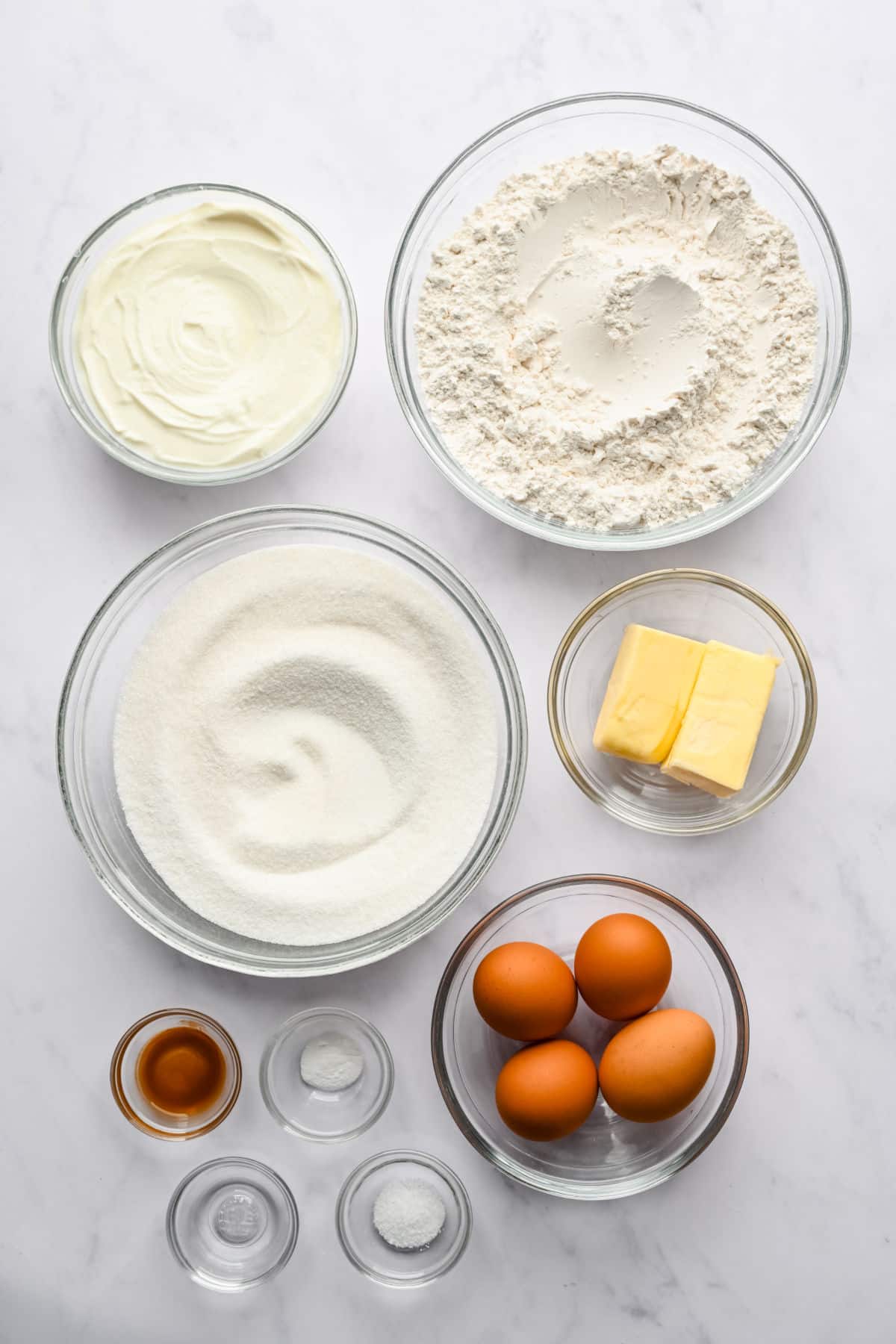 Ingredients for Greek yogurt pound cake in glass dishes. 