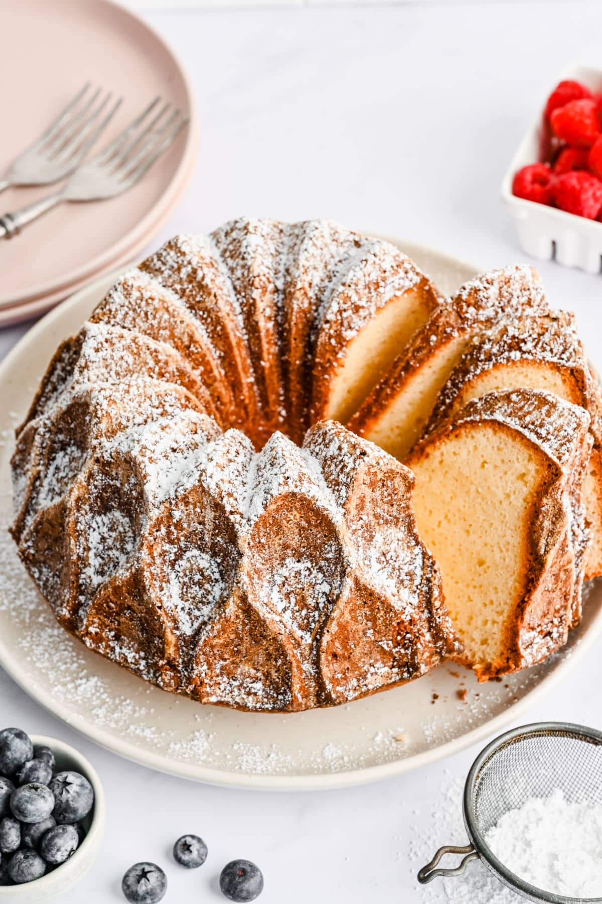 Three slices of Greek yogurt pound cake cut from the rest of the cake.