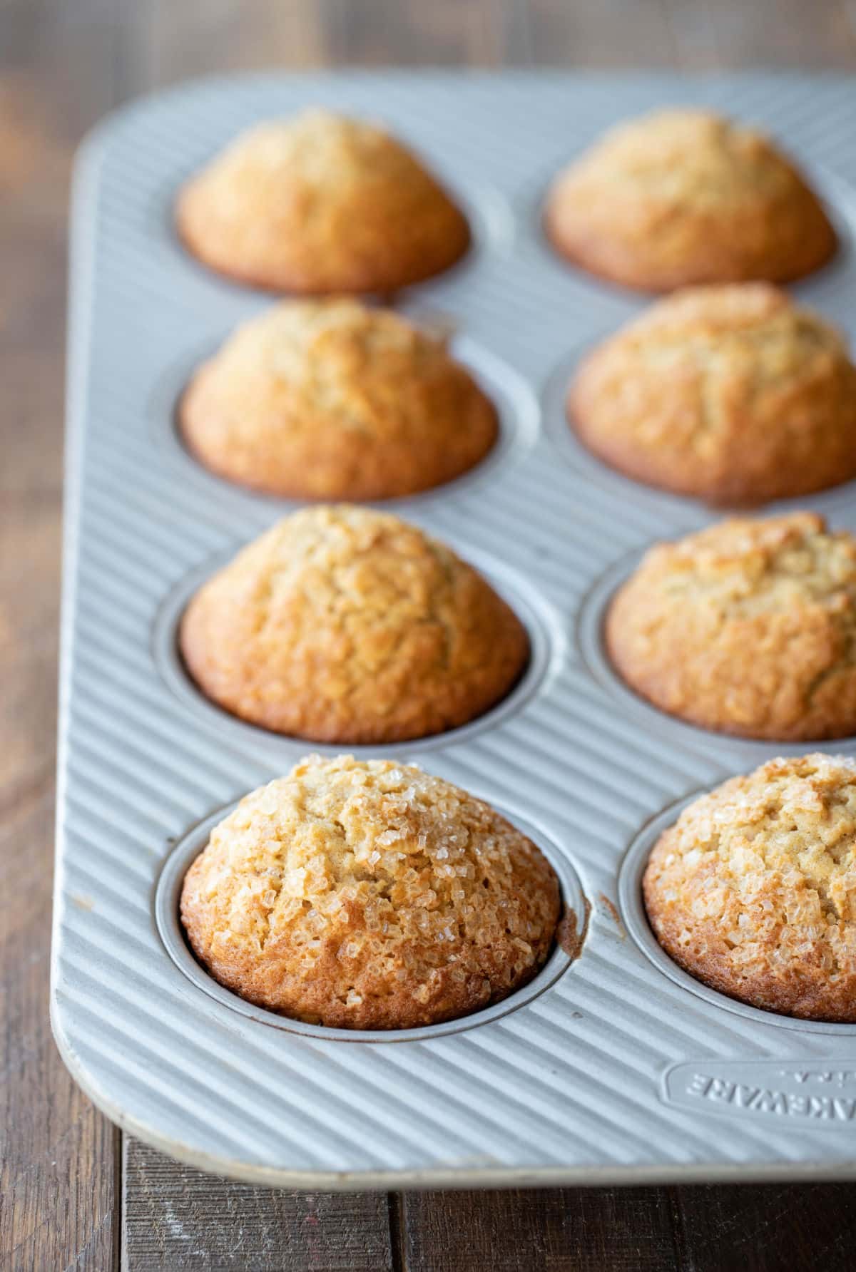 Baked oatmeal muffins in a silver muffin tin.