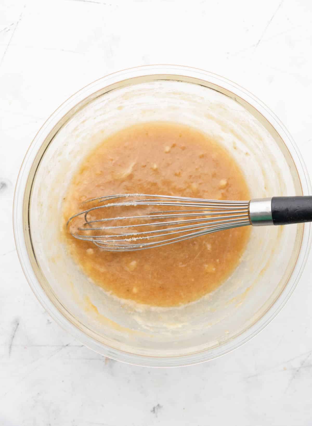 Brown sugar and granulated sugar mixed into banana mixture.