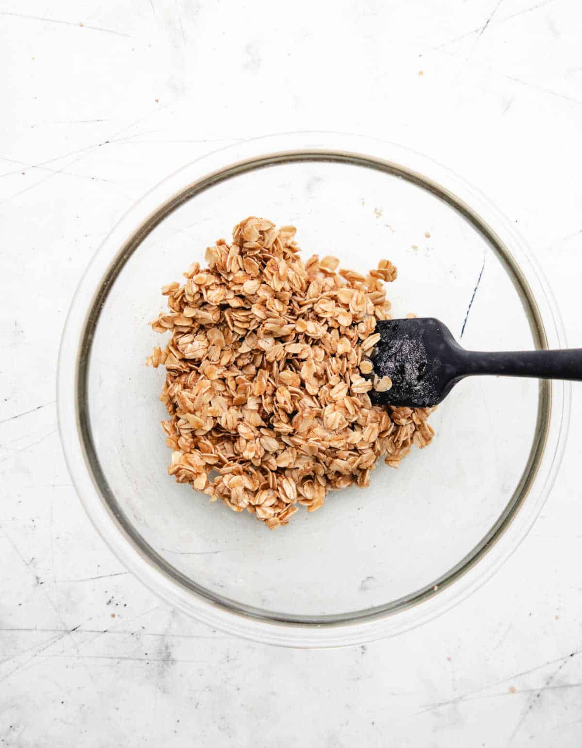 Oatmeal topping in a glass mixing bowl. 