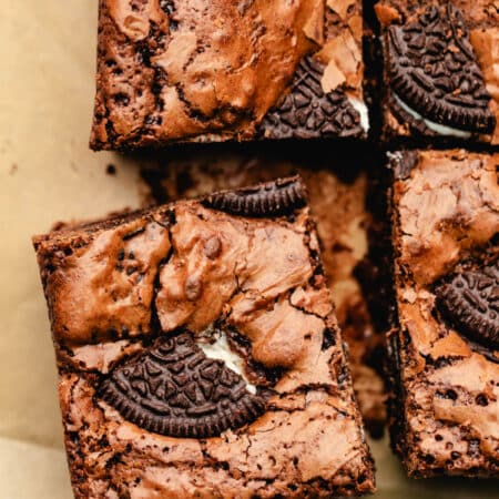 An Oreo brownie cut and pulled slightly away from the other brownies.