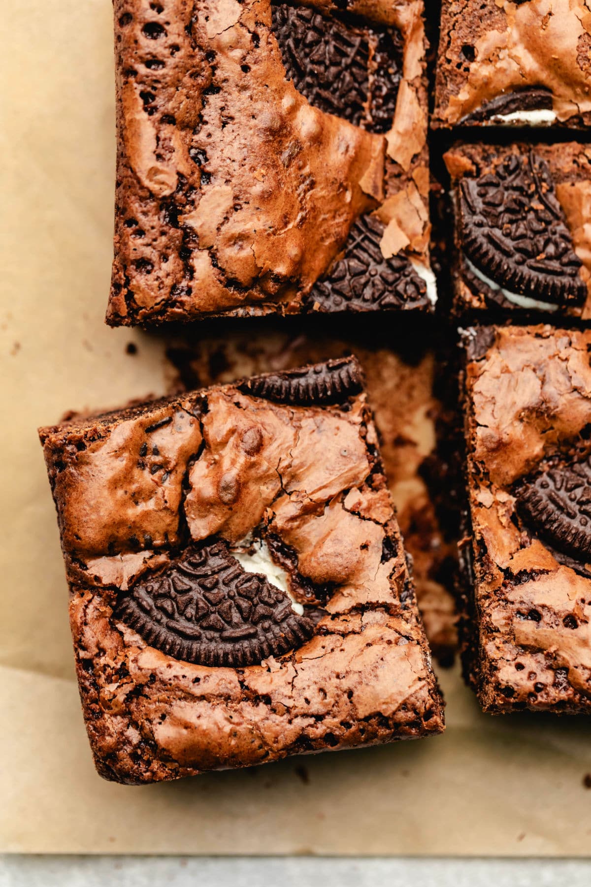 An Oreo brownie cut and pulled slightly away from the other brownies.