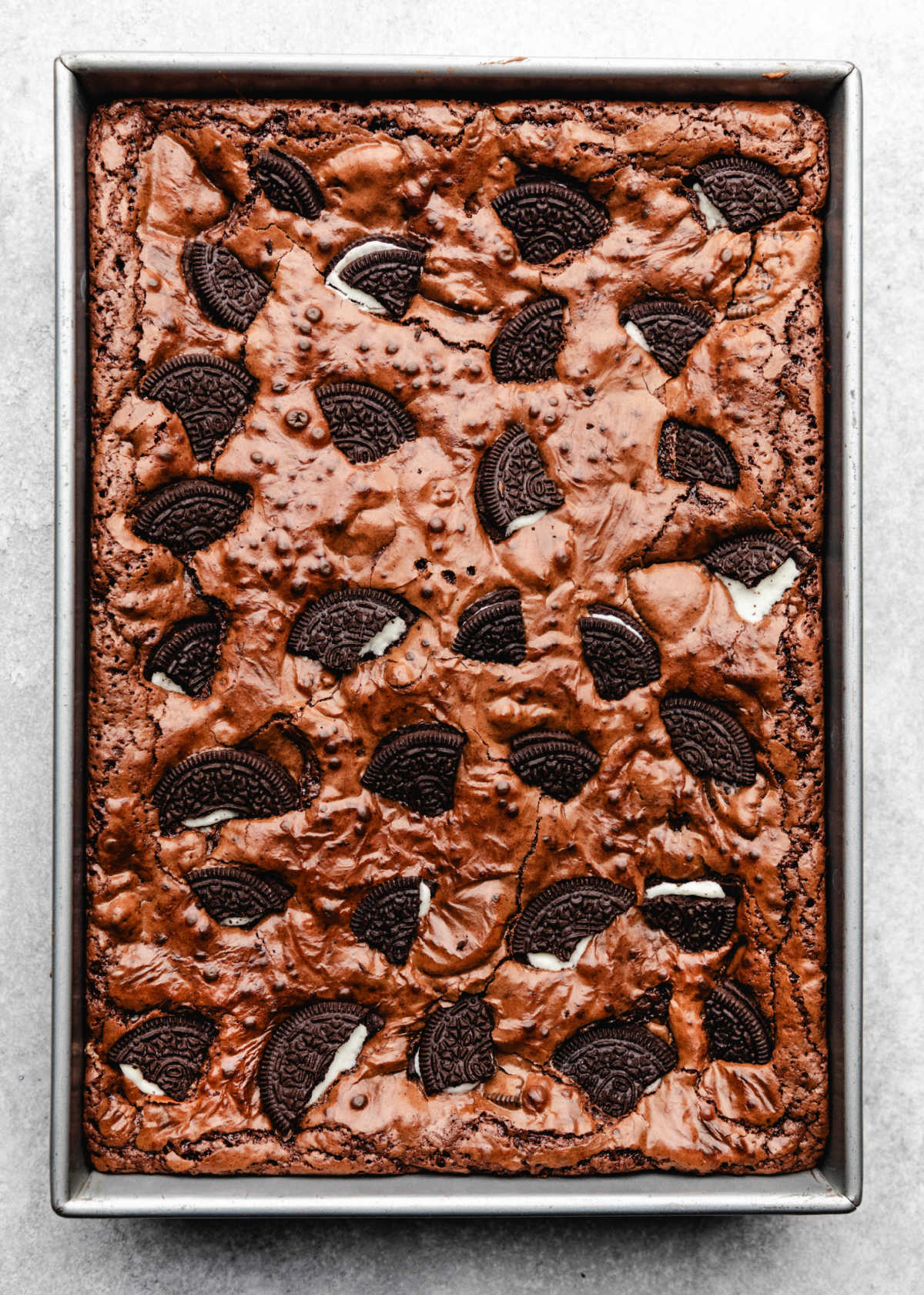 Baked oreo brownies in a baking pan.