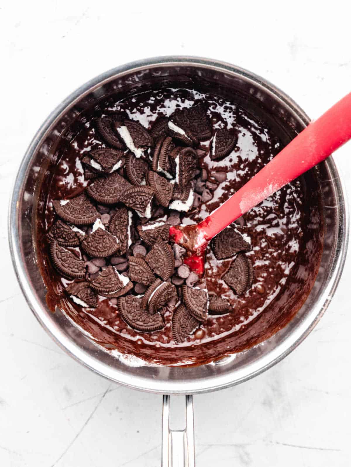 Oreos stirred into brownie batter. 