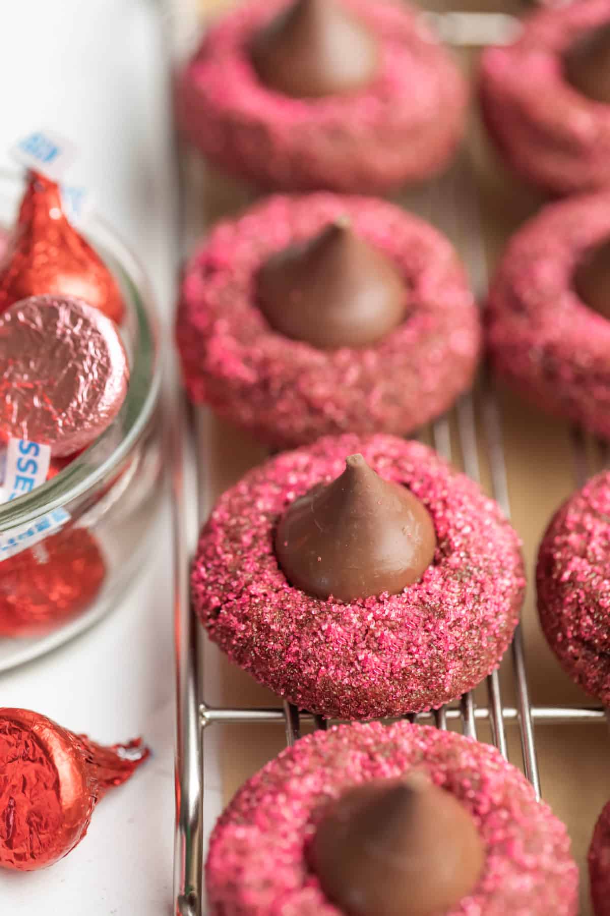 Valentine's Day kiss cookies coated in pink sanding sugar. 