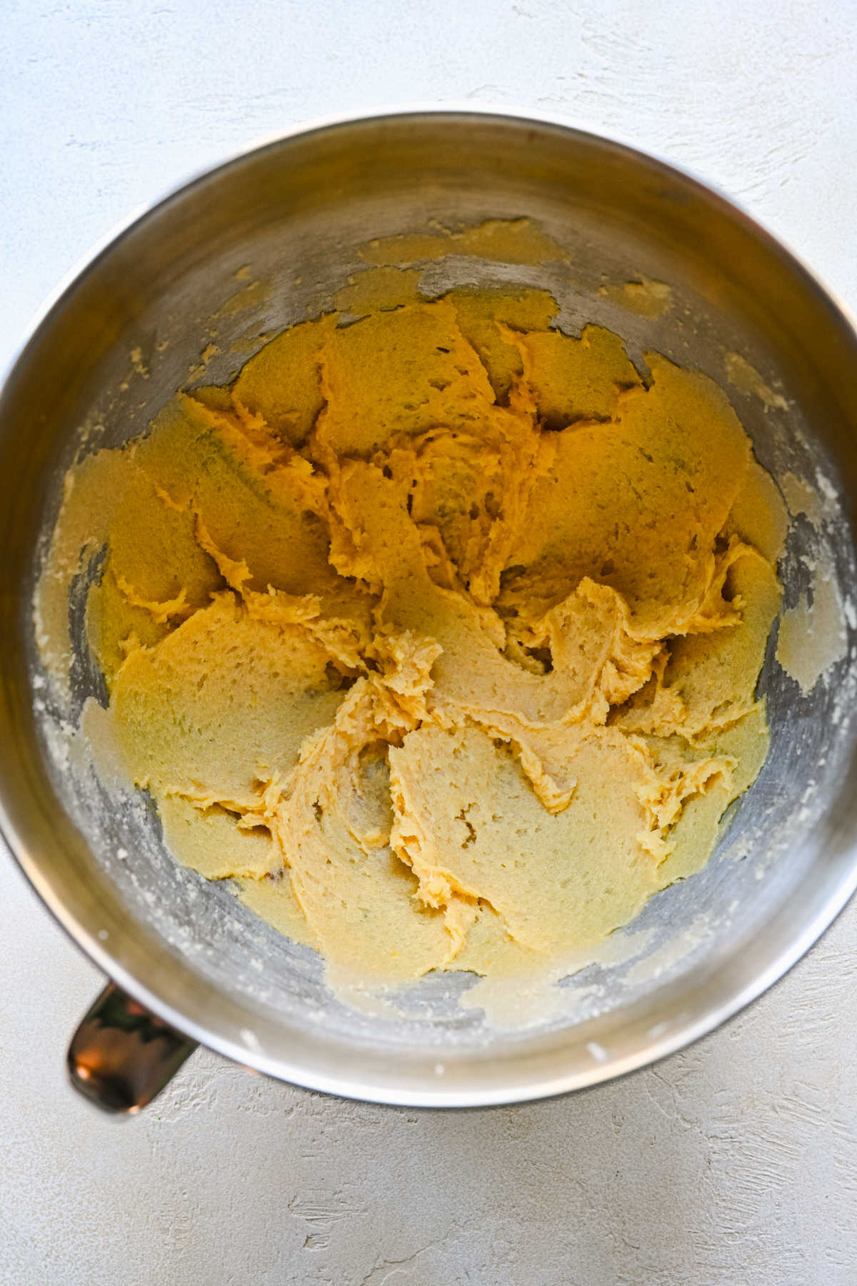 Egg yolks mixed into creamed butter mixture.