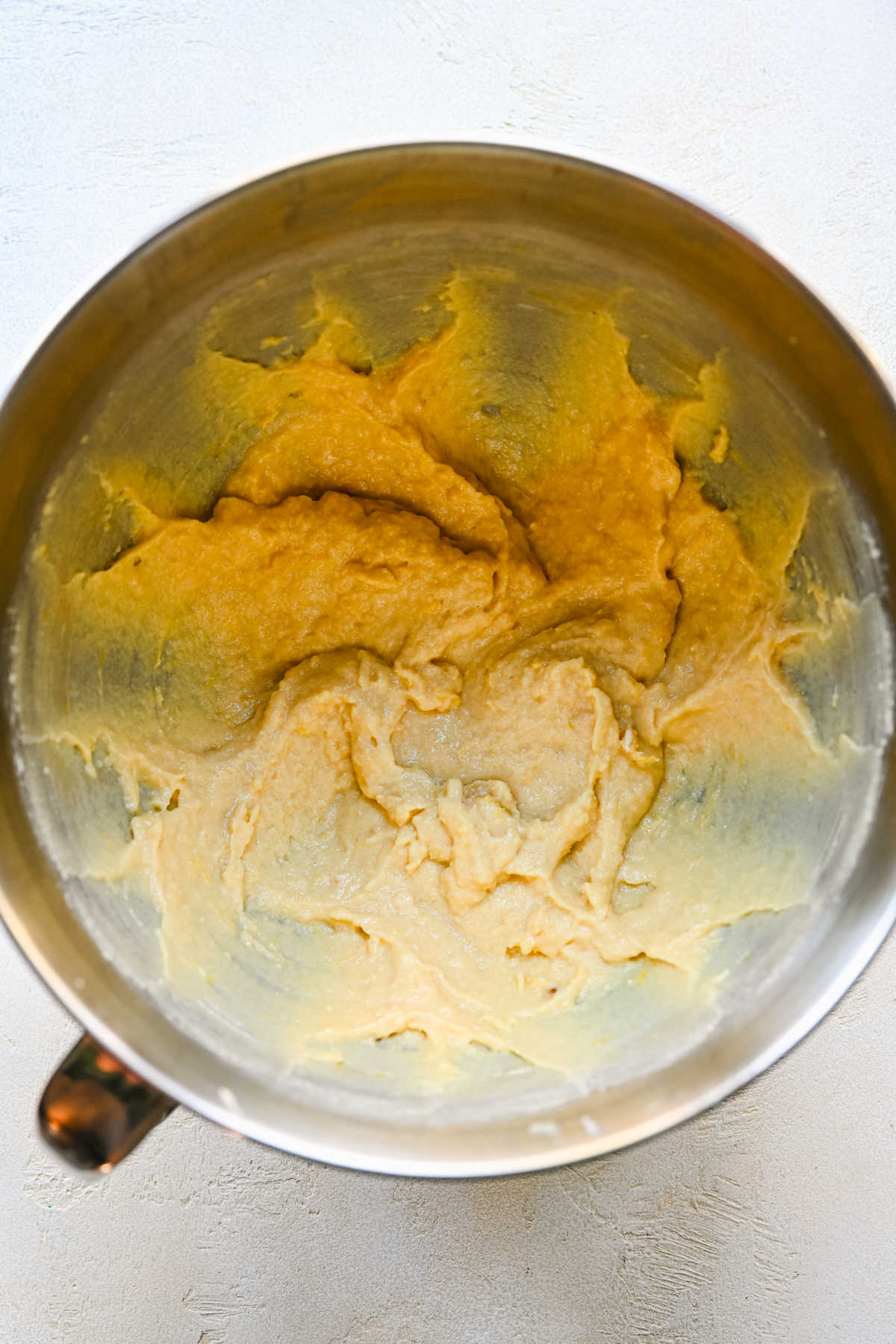 Sour cream milk and flavoring mixed into creamed butter mixture.
