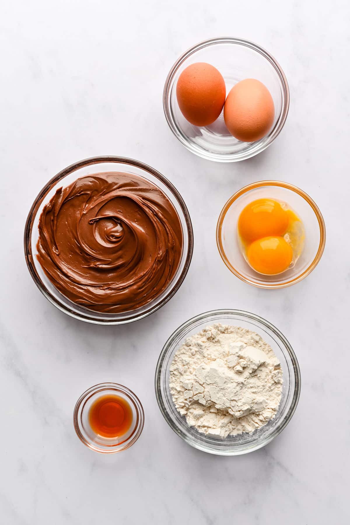 Ingredients for Nutella molten lava cakes in dishes.