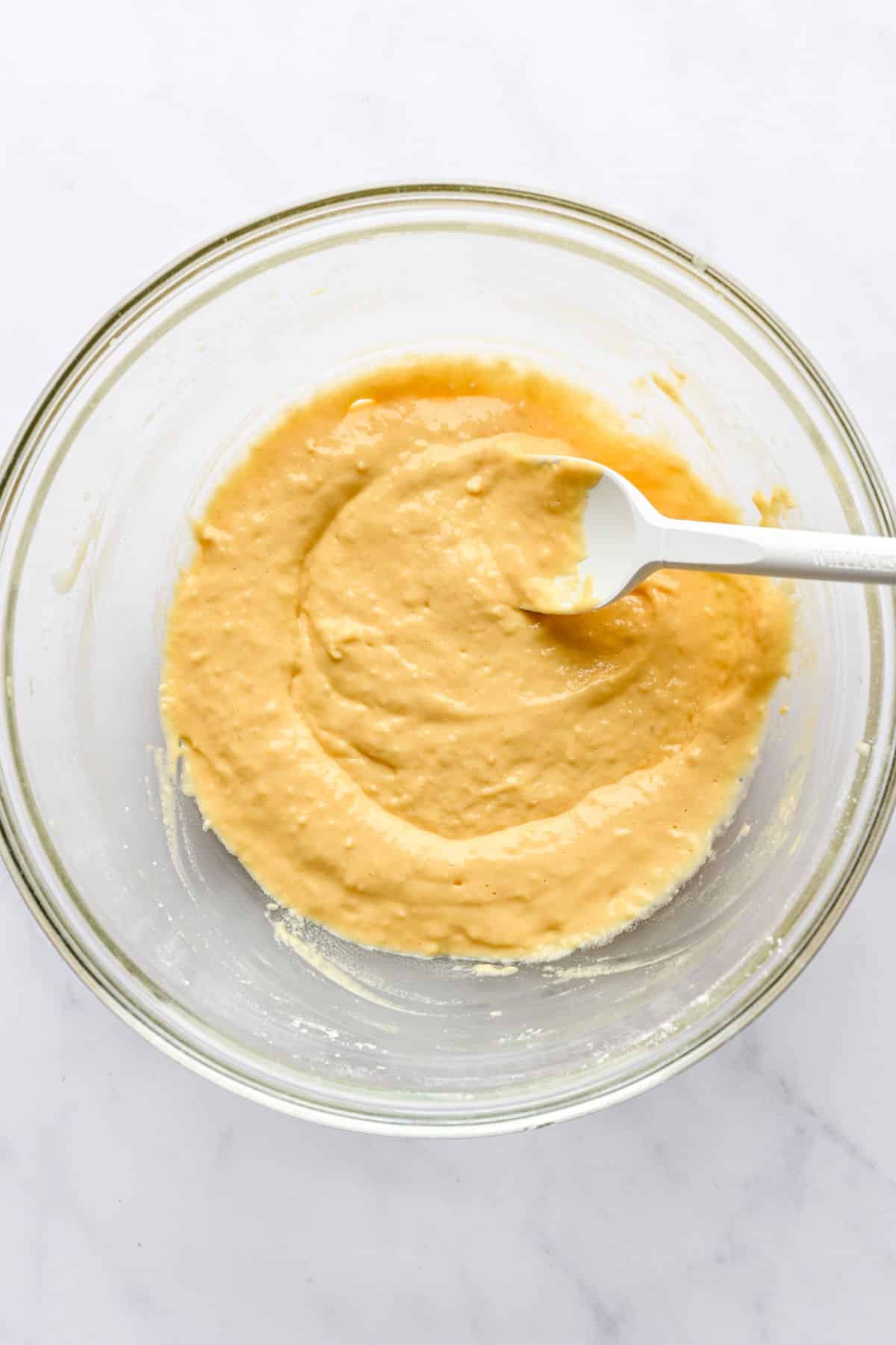 Flour stirred into beaten eggs.