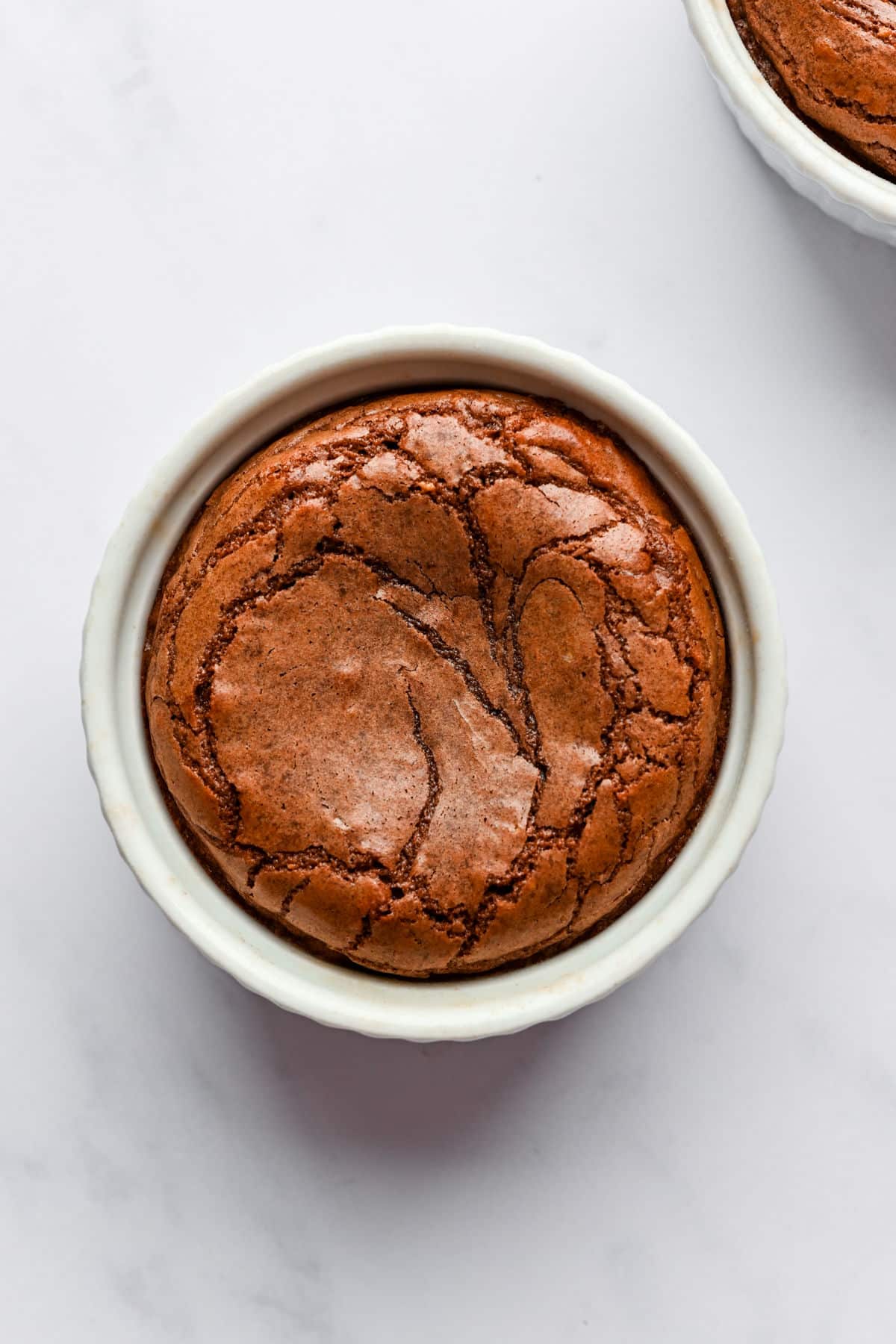 Baked Nutella molten lava cake in a ramekin.
