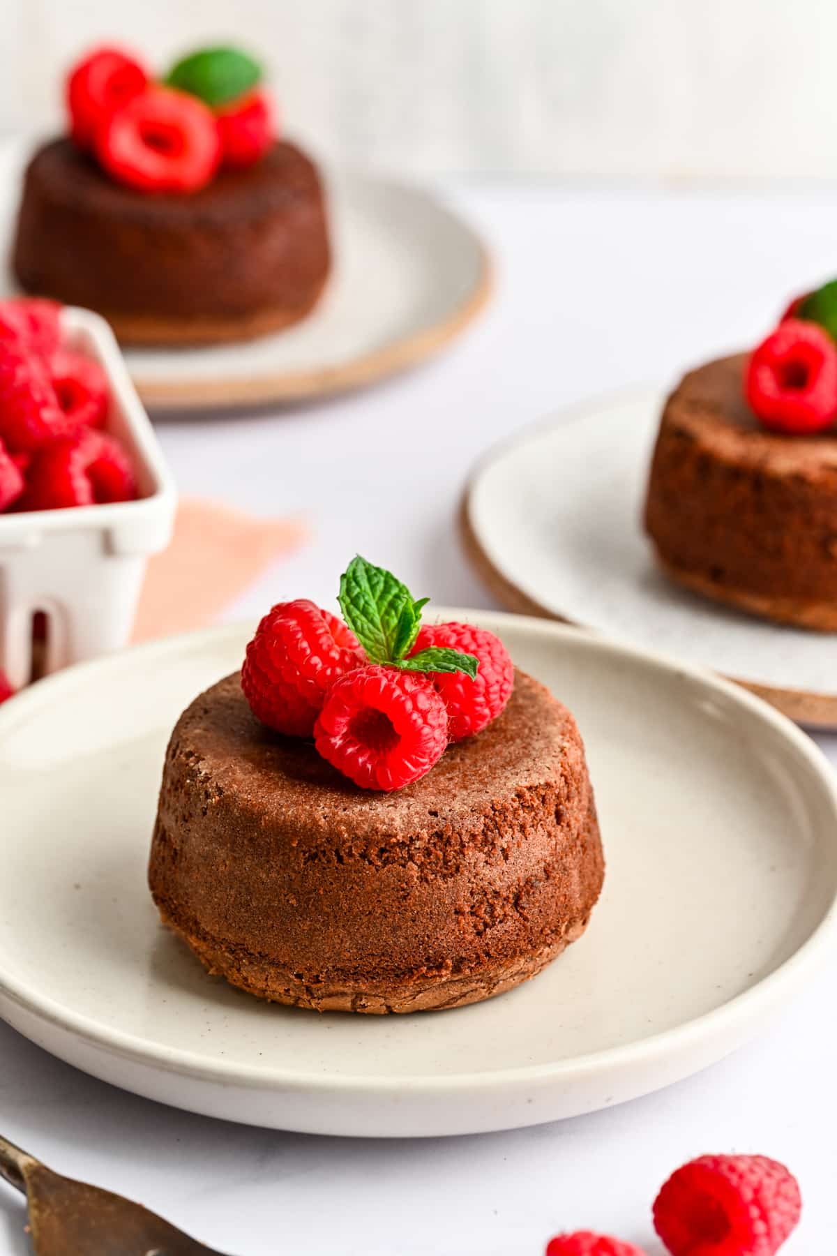 A Nutella lava cake topped with fresh raspberries. 