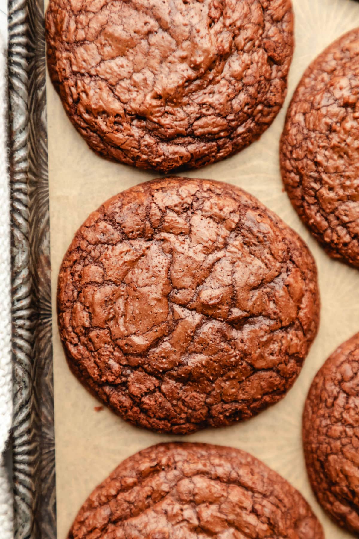 Rows of brownie cookies on a vintage baking sheet. 