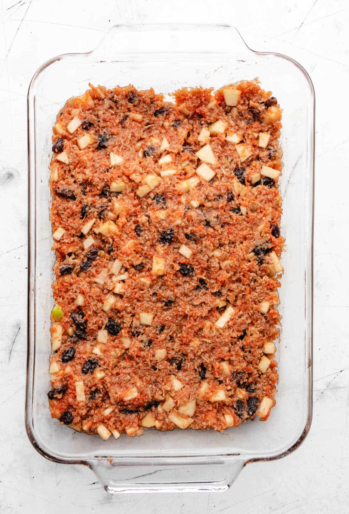 Unbaked steamed carrot pudding mixture in a baking dish. 