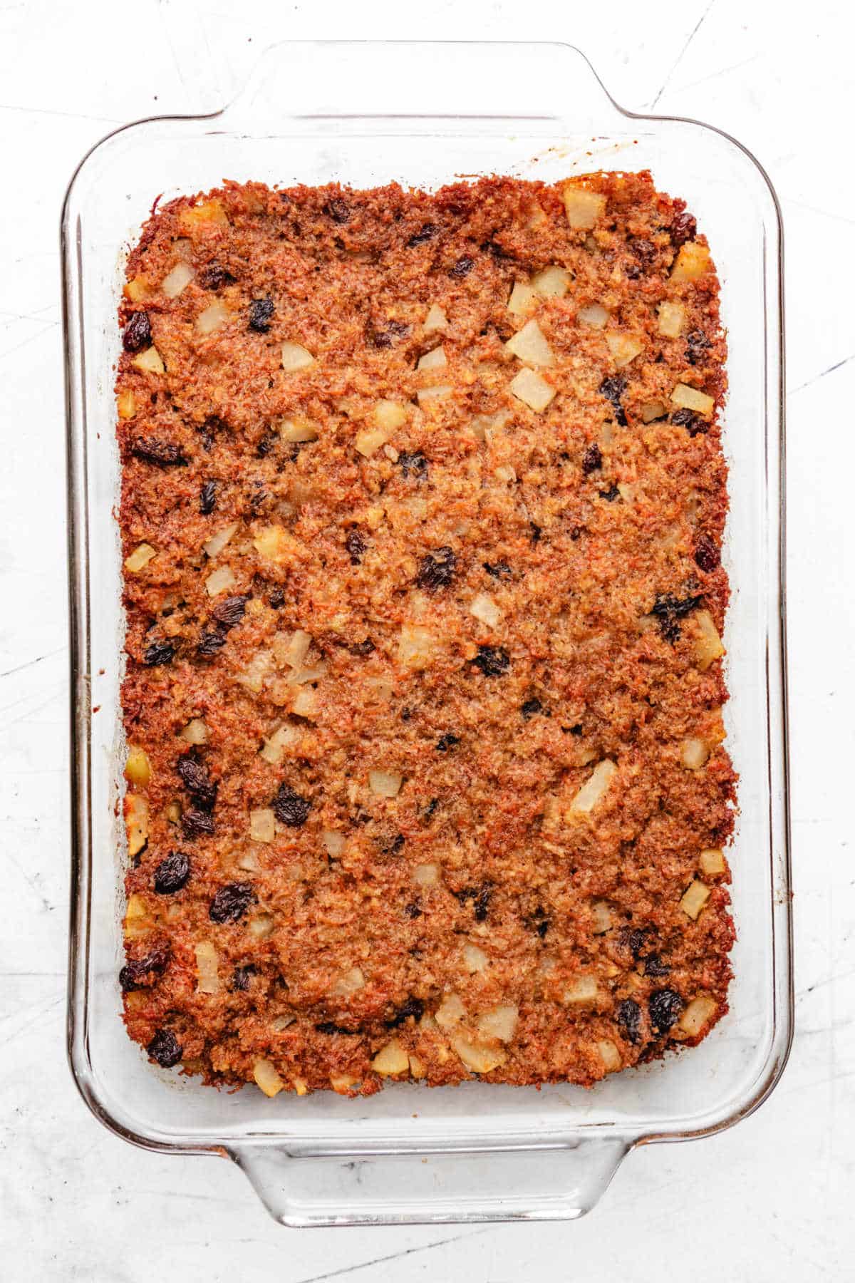 Baked steamed carrot pudding in a baking dish.