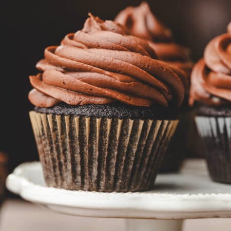 Chocolate cupcakes frosted with chocolate cream cheese frosting.