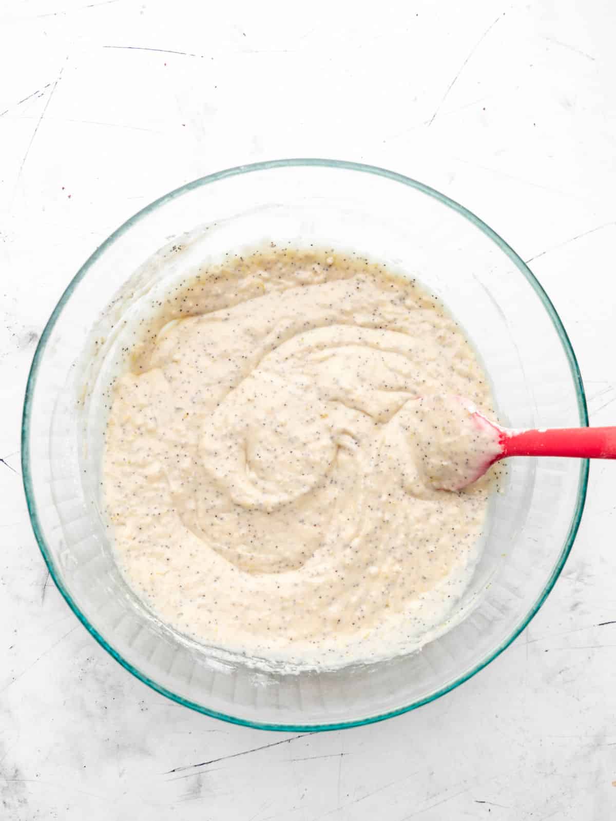 Lemon poppy seed batter in a mixing bowl. 