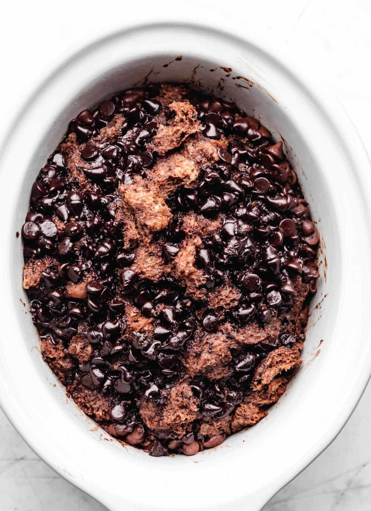 Cooked triple chocolate bread pudding in a crock pot. 