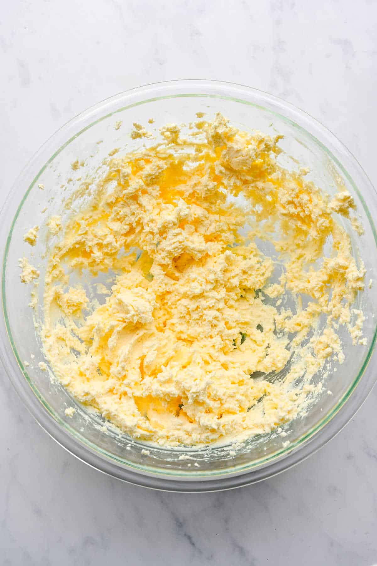 Beaten butter and cream cheese in a mixing bowl.
