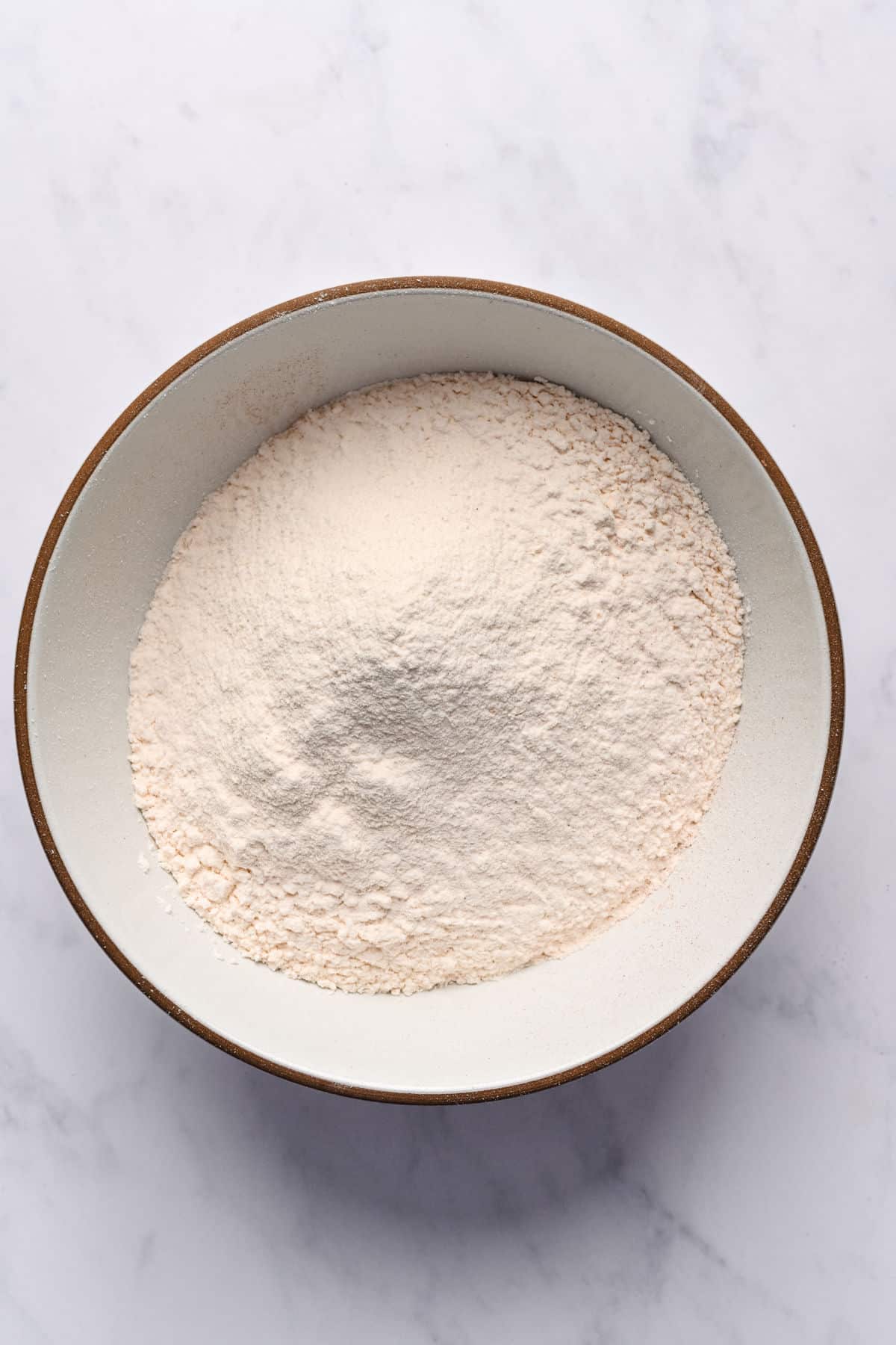 Dry ingredients for hummingbird cake in a bowl.