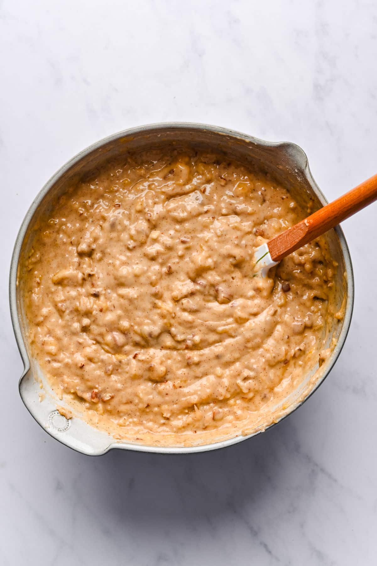 Chopped pecans and coconut mixed into hummingbird cake batter.
