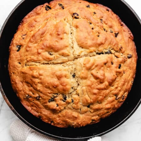 Irish soda bread in a cast iron skillet.