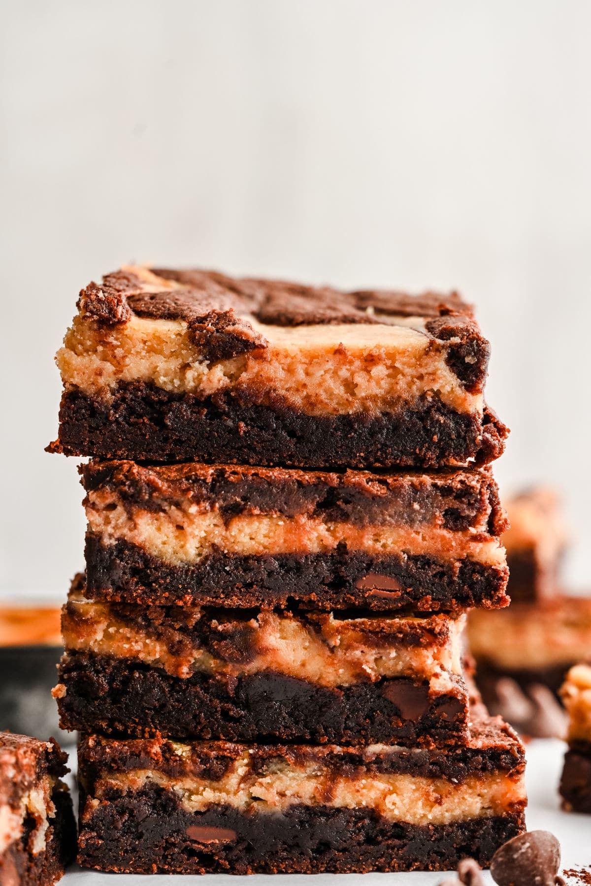 Four peanut butter brownies stacked on top of each other.