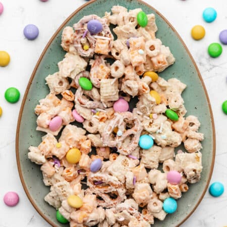 A plate of bunny bait next to a dish of Easter M&Ms.