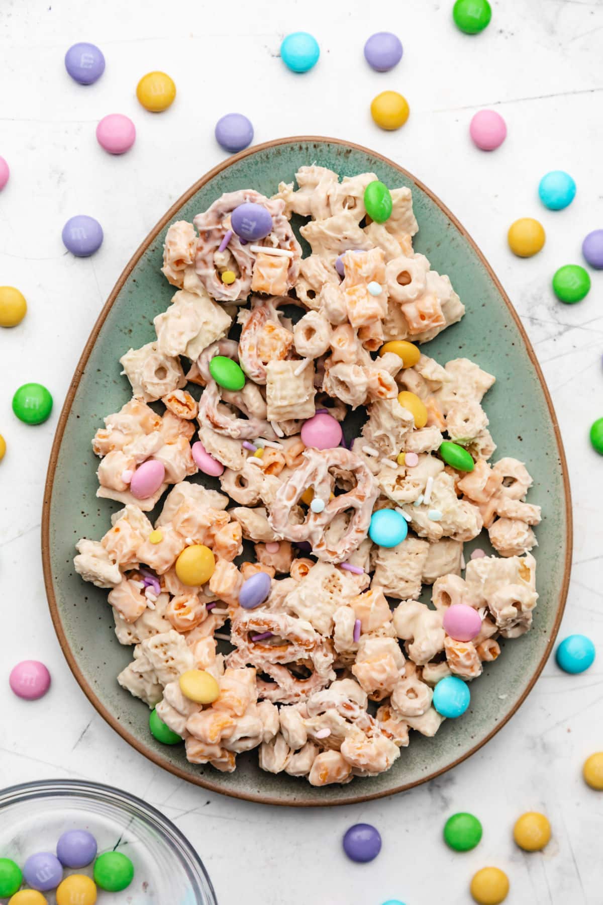 A plate of bunny bait next to a dish of Easter M&Ms.