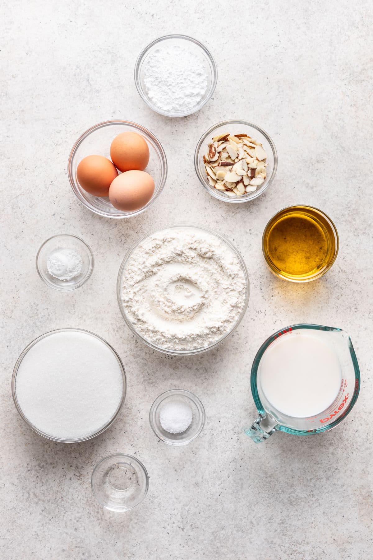 Olive oil cake ingredients in dishes. 