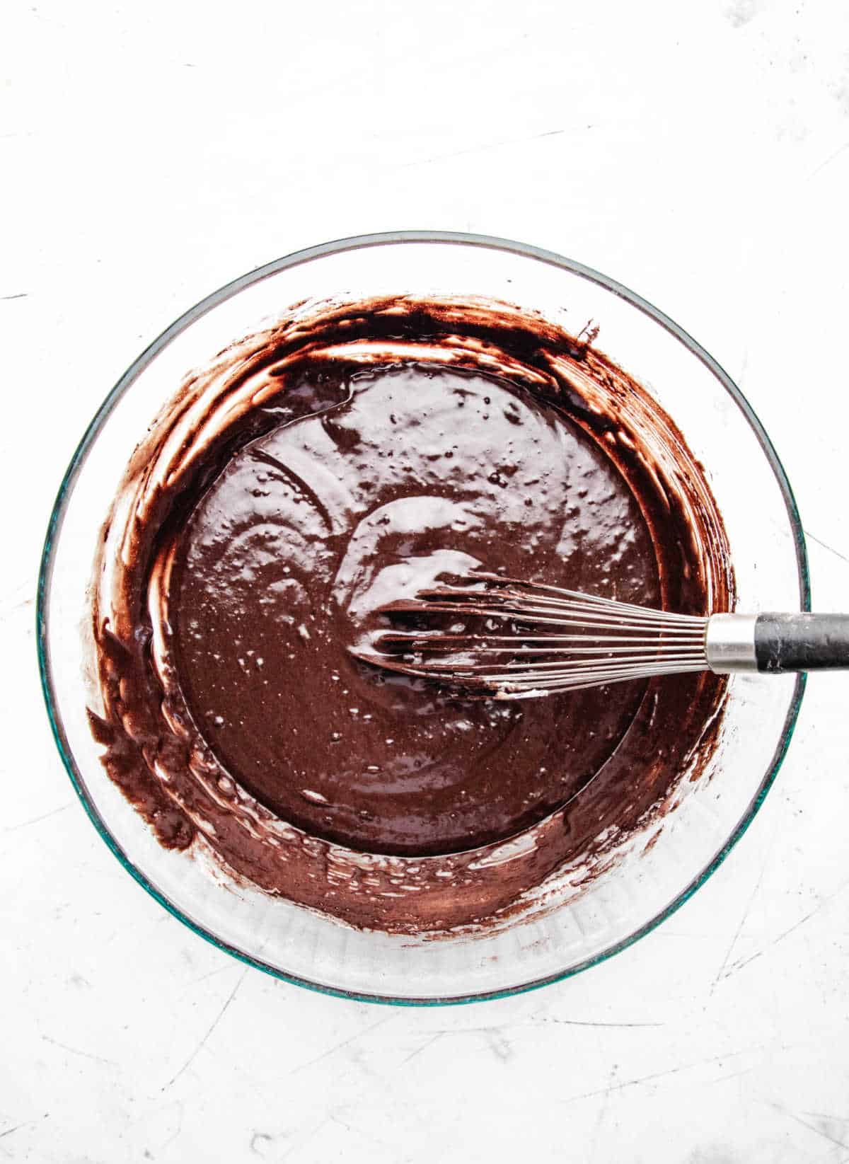 Dry ingredients for double chocolate muffins whisked into wet ingredients. 