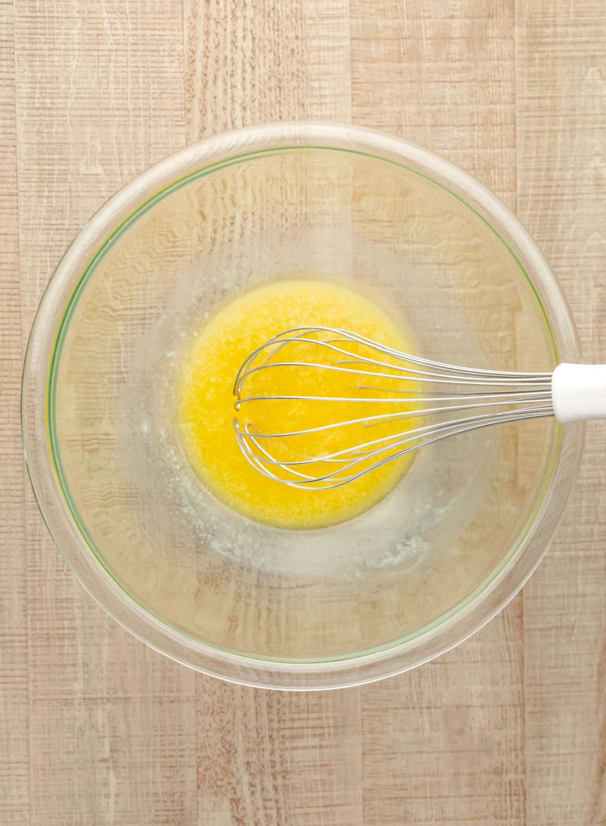 Melted butter in a glass mixing bowl. 