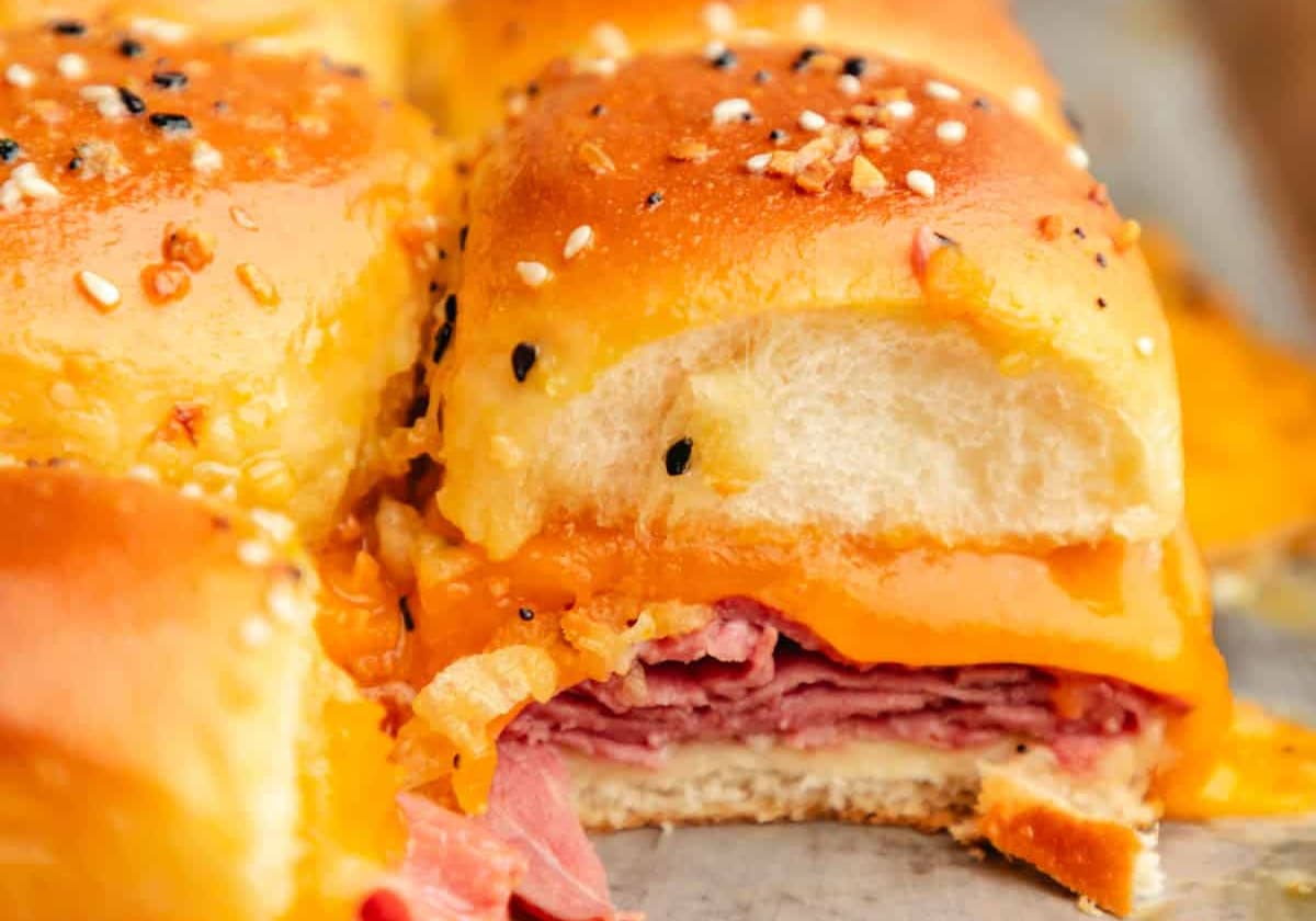 A baked roast beef slider on a baking sheet.