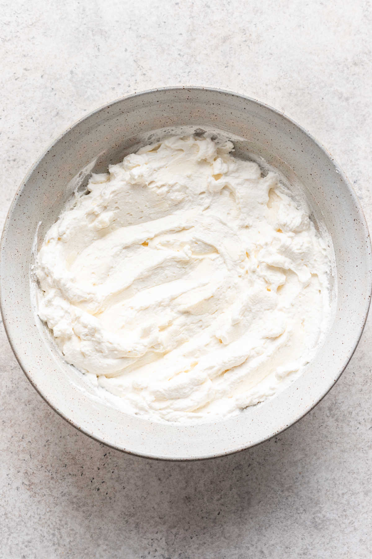 Powdered sugar beaten with whipped cream. 