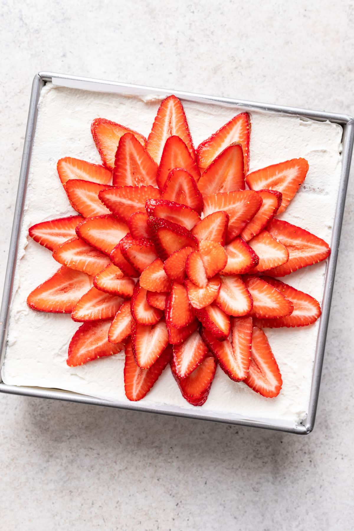 A strawberry icebox cake in a pan.