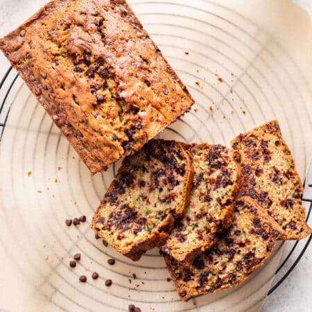Chocolate chip zucchini bread on a wire cooling rack.