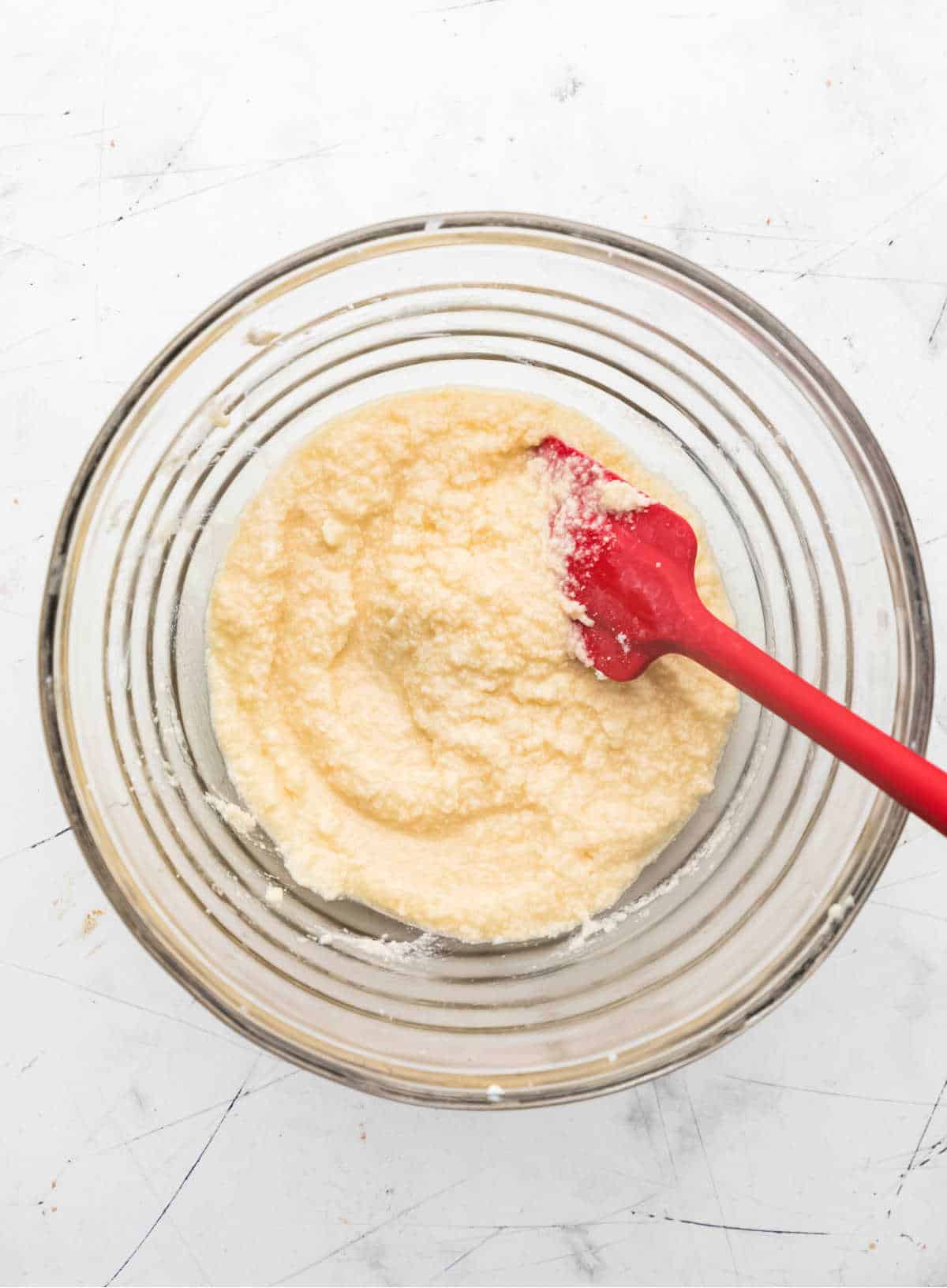 Eggs and egg yolks mixed into creamed butter mixture.