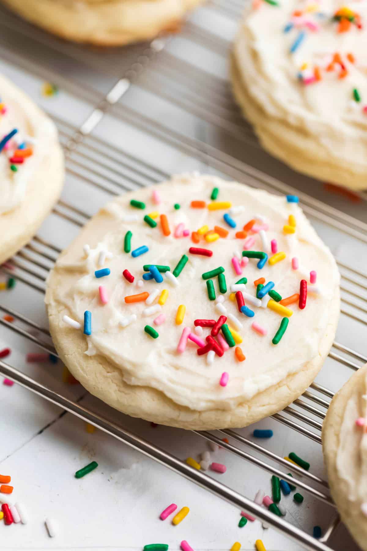 Lofthouse Cookie Copycat Recipe White frosted Lofthouse copycat sugar cookies topped with rainbow sprinkles.