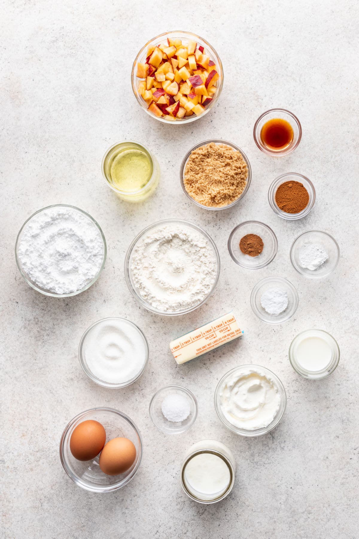 Ingredients for peach cobbler cake in dishes.