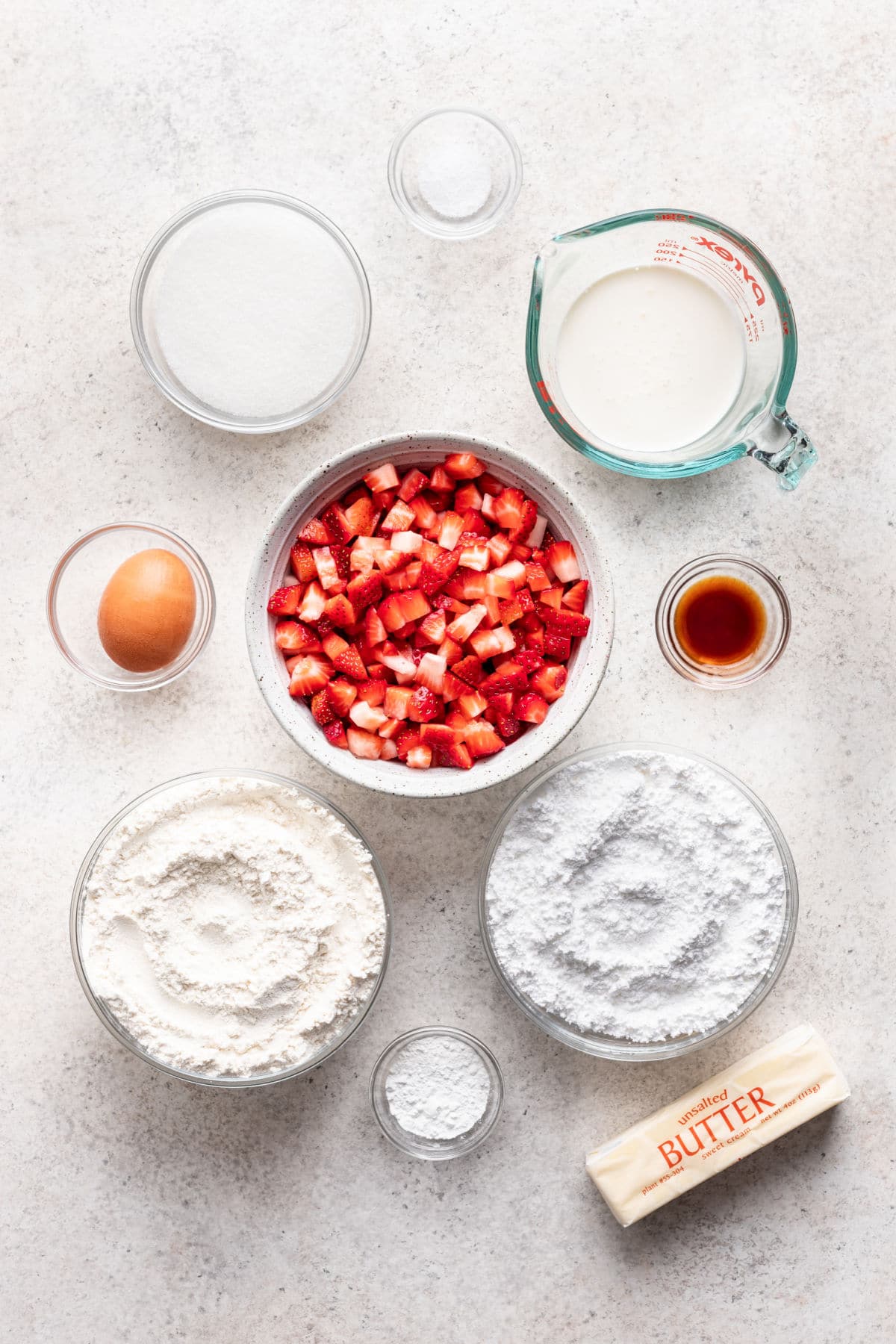 Ingredients for strawberry scones in dishes.