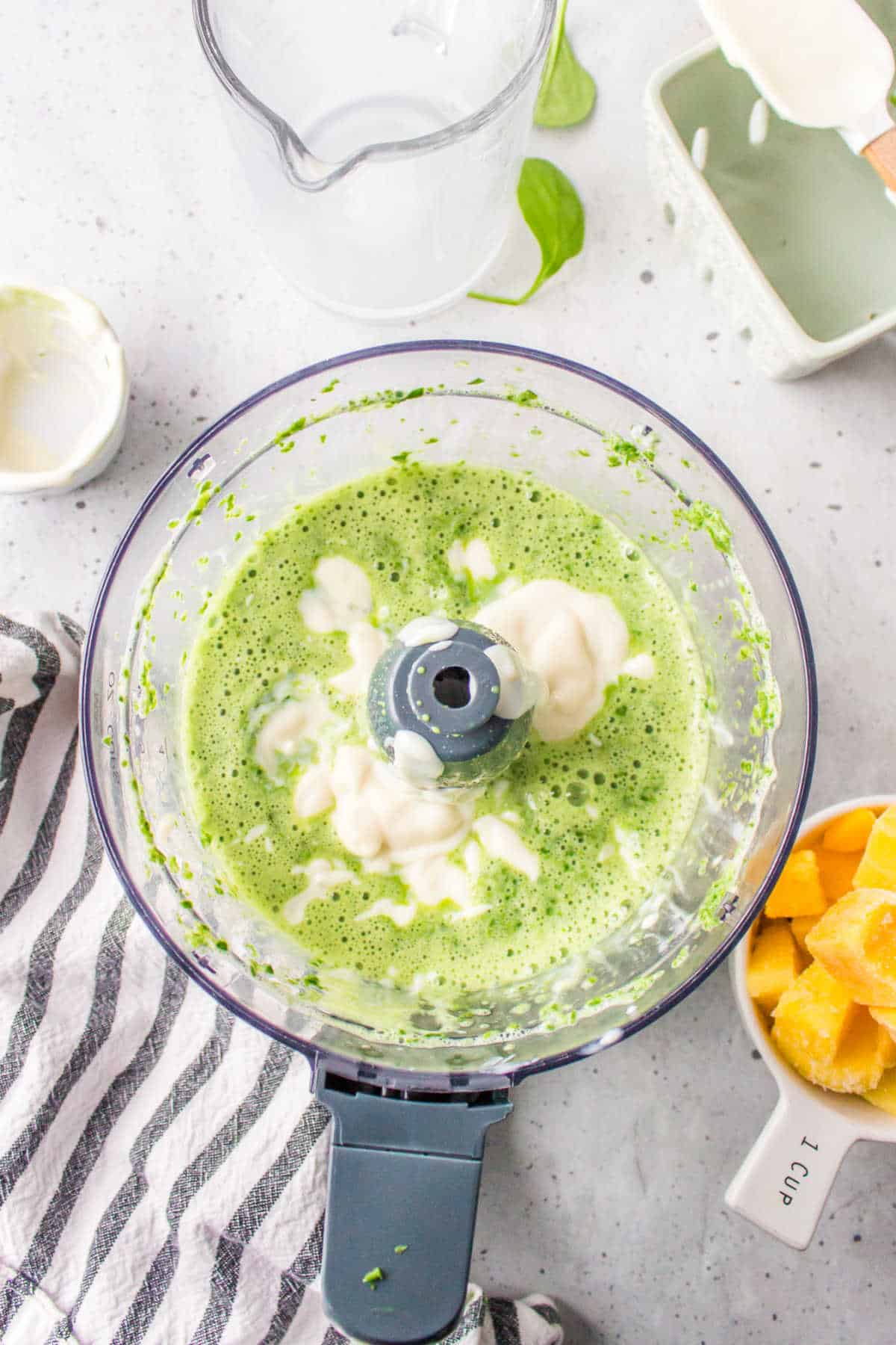 Yogurt blended into milk and spinach mixture.